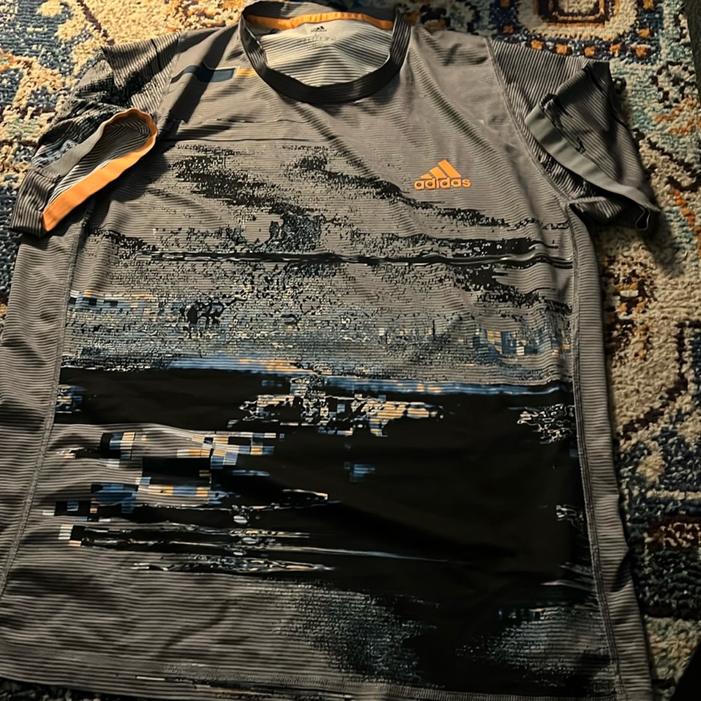 Adidas grey graphic with orange logo dri fit style t. Elastic banding @sleeves.